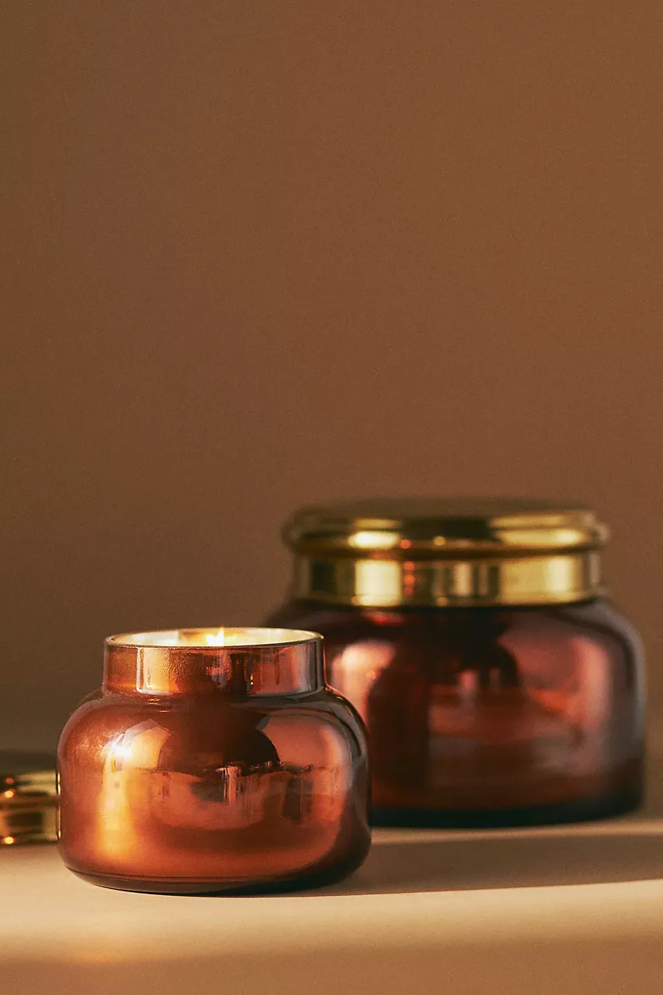 Amber glass candle jars with gold lids