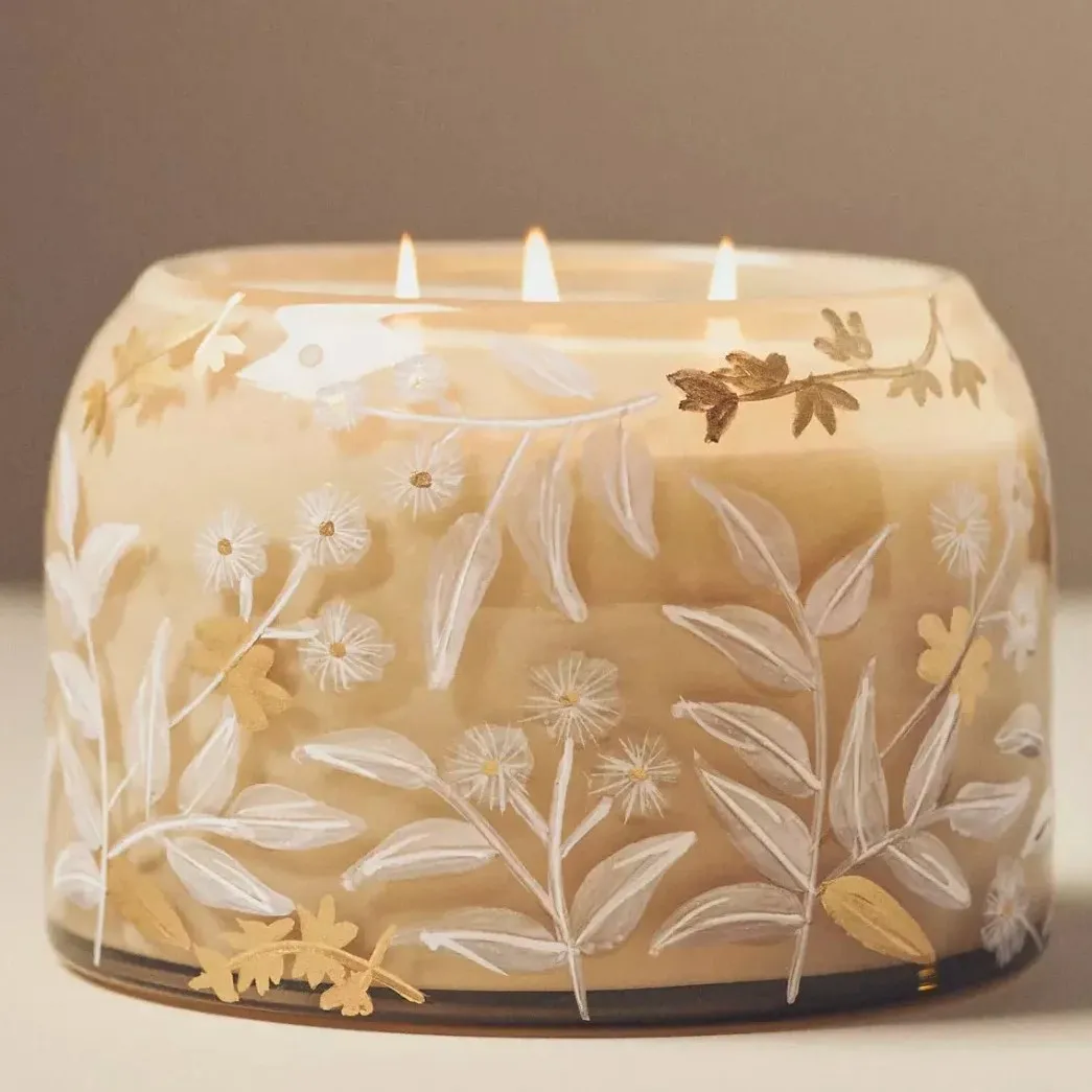 Hand-painted floral design on glass candle
