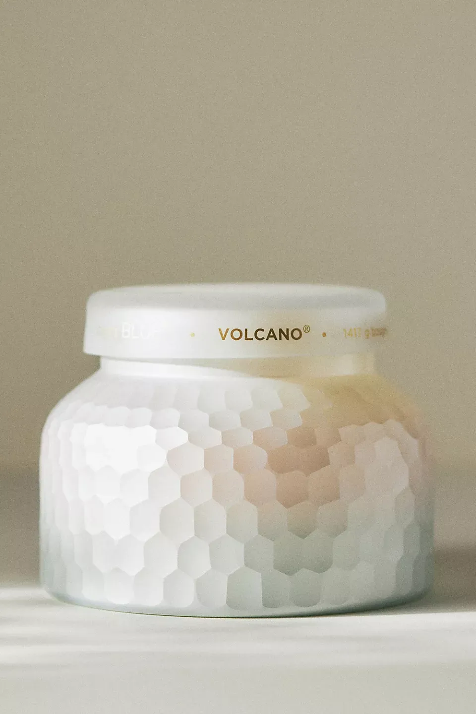 Frosted glass jar with faceted honeycomb texture