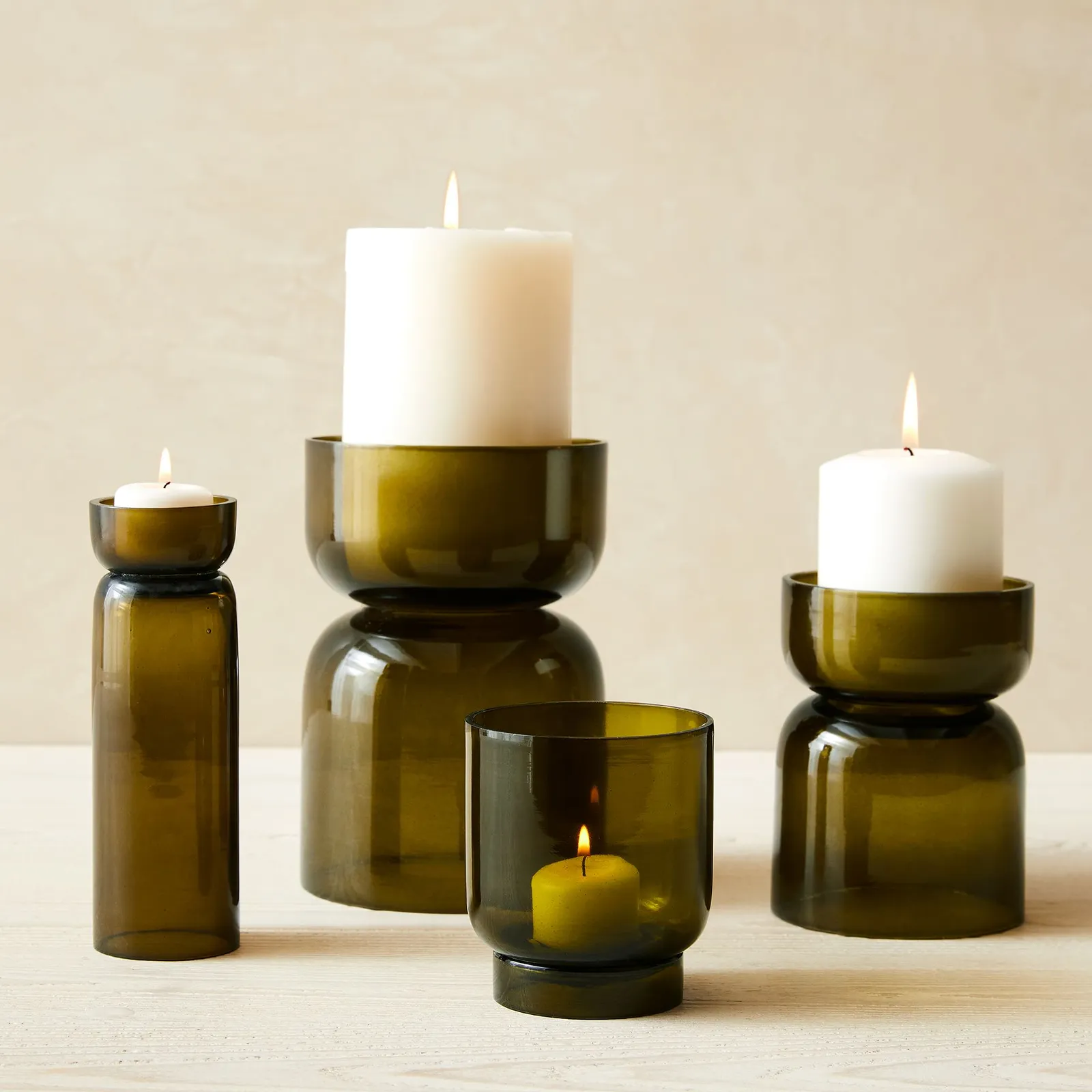 Olive tinted glass pillar holders